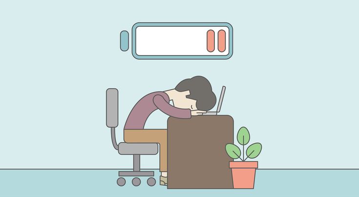 Illustration of a drained creator slumped over a desk with a low battery symbol overhead